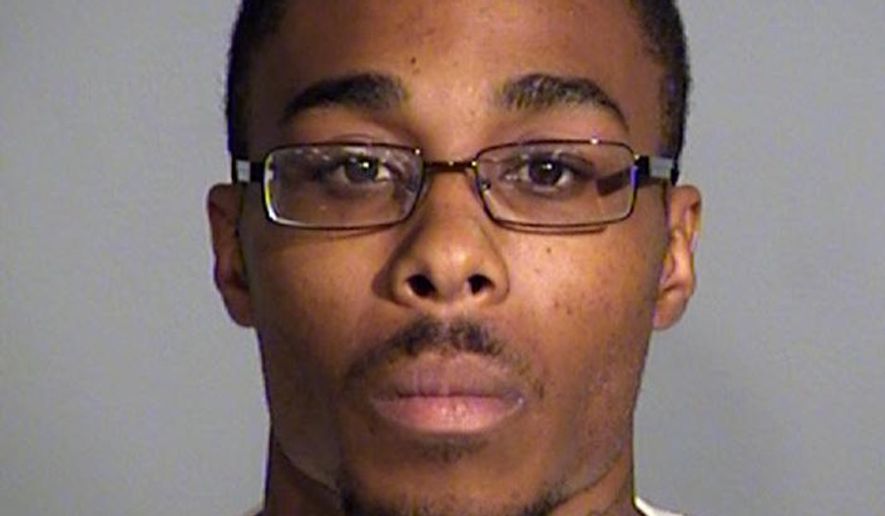 March E. Ratney II is shown in an undated photo provided by the Indianapolis Metropolitan Police Department. Ratney, who allegedly fired shots into a police officer's home on Tuesday, July 12 as his wife and child slept inside has been charged with criminal recklessness and unlawful possession of a firearm by a serious violent felon. He is being held without bond. The officer, his wife and child were not injured. (Indianapolis Metropolitan Police Department via AP)