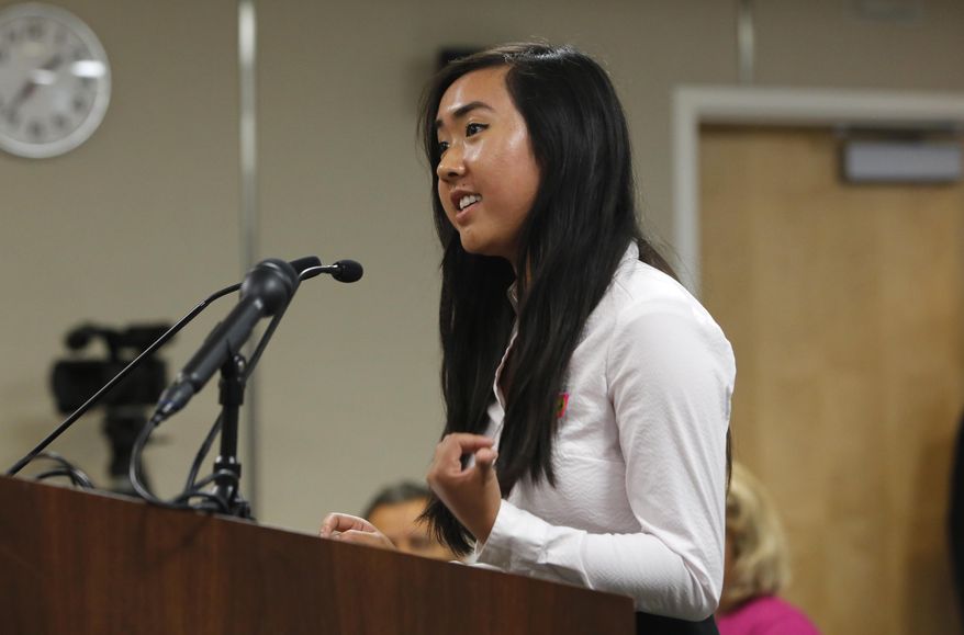 Allyson Chiu, 17, a senior at Cupertino High School, was one of several speakers calling for members of the State Board of Education to adopt proposed changes in classroom instruction to include prominent gay people and LGBT rights milestones in history classes, Thursday, July 14, 2016, in Sacramento, Calif. California education officials are considering the proposals as part of a broader overhaul of California's history and social science curriculum. (AP Photo/Rich Pedroncelli)