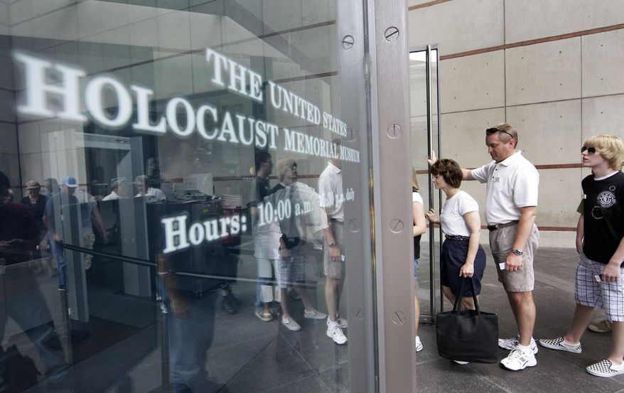FILE - In this June 12, 2009, file photo, people stand in line to enter the U.S. Holocaust Memorial Museum in Washington. The U.S. museum is requesting that smartphone users refrain from "catching" Pokemon when they are inside the museum. Museum Communications Director Andrew Hollinger tells The Washington Post that officials are trying to reach game developers to get the museum removed as a prominent location in the popular new "Pokemon Go" smartphone game. (AP Photo/Alex Brandon, File)