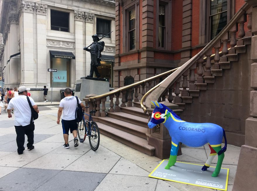 This July 7, 2016 photo shows a donkey outside the Union League in Philadelphia. It's one of 57 fiberglass donkeys placed around the city, which is hosting the Democratic National Convention this month. (AP Photo/Beth J. Harpaz)
