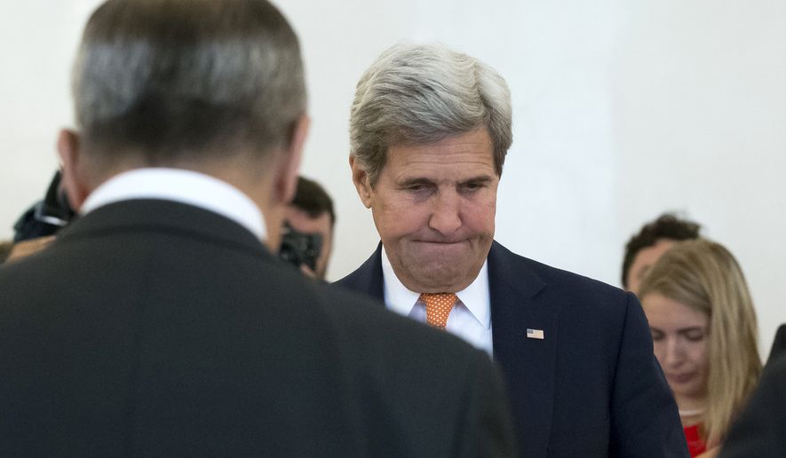 U.S. Secretary of State John Kerry, right, and Russian Foreign Minister Sergey Lavrov, left back to a camera, hold a minute of silences for victims of the truck attack in France during their meeting in Moscow, Russia, Friday, July 15, 2016. The United States is offering Russia a broad new military partnership in Syria. (AP Photo/Alexander Zemlianichenko)