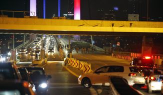 Turkish soldiers block Istanbul&#39;s iconic Bosporus Bridge on Friday, July 15, 2016, lit in the colours of the French flag in solidarity with the victims of Thursday&#39;s attack in Nice, France. A group within Turkey&#39;s military has engaged in what appeared to be an attempted coup, the prime minister said, with military jets flying over the capital and reports of vehicles blocking two major bridges in Istanbul. Prime Minister Binali Yildirim told NTV television: &quot;it is correct that there was an attempt,&quot; when asked if there was a coup. (AP Photo/Emrah Gurel)