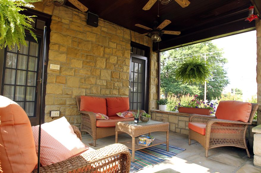 ADVANCE FOR SUNDAY JULY 17 AND THEREAFTER - This Thursday July 7, 2016 photo shows a porch at the home of Kati and Will Holland in Huntington, W.Va. The Hollands offer guest rooms at their home in Huntington on Airbnb. (Lori Wolfe/The Herald-Dispatch via AP)