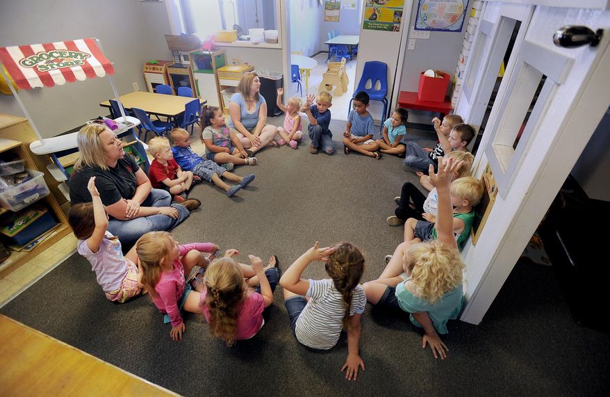 ADVANCED FOR RELEASE SATURDAY, JULY 23, 2016 Students at Kids Korner preschool start the day with circle time. The students are given a chance to talk about their activities the day before. Instructors also outline what students will be doing the rest of the day. (Monte LaOrange/The Post-Register via AP)