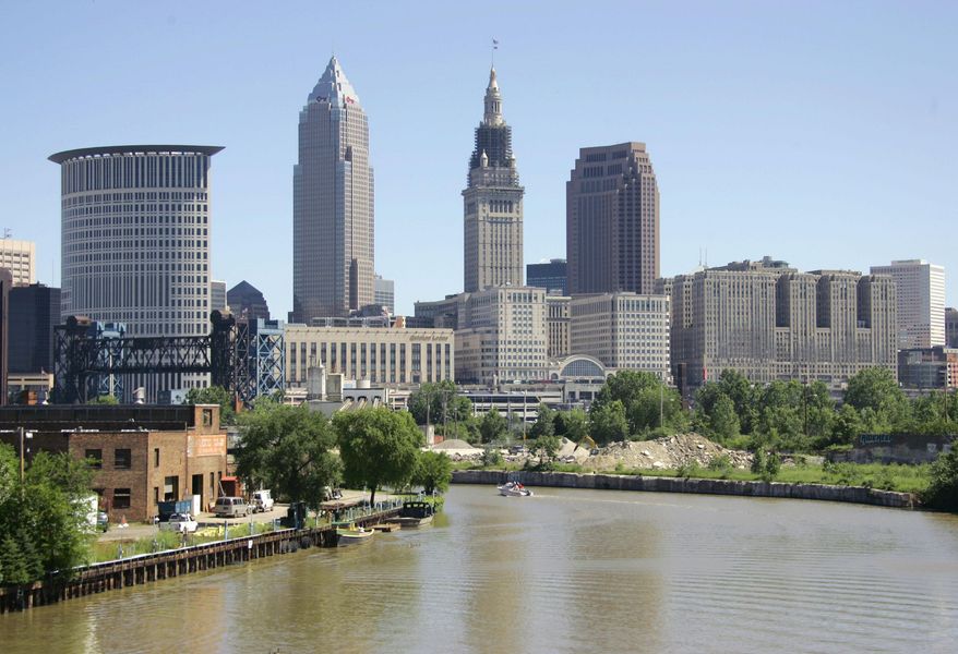 FILE – This July 15, 2008, file photo shows the Cuyahoga River in Cleveland. The river, which flows through the city's downtown into Lake Erie, was once so polluted it caught fire at least 13 times, alarming environmentalists and leading to a host of national water quality regulations. Cleveland is hosting the Republican National Convention from Monday through Thursday, July 18 to 21, 2016. (AP Photo/Mark Duncan, File)