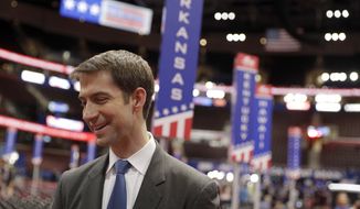 U.S. Sen. Tom Cotton, R-Ark., talks to a reporter on the floor of the Republican National Convention, Sunday, July 17, 2016, in Cleveland. (AP Photo/John Locher) ** FILE **