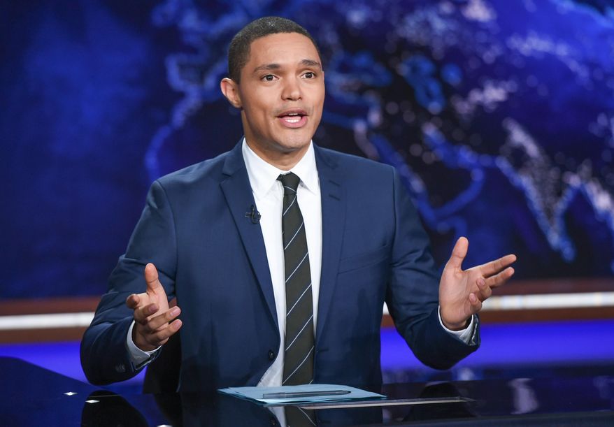 FILE - In this Sept. 29, 2015 file photo, Trevor Noah appears during a taping of "The Daily Show with Trevor Noah" in New York The new "Daily Show" host is finding his footing after a rough start replacing Jon Stewart, the man who made the broadcast essential. His comedy is sharper, he's becoming more comfortable with his adopted country and he's finding an audience of his own, even if smaller than his predecessor's.. (Photo by Evan Agostini/Invision/AP, File)