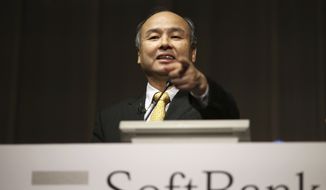 SoftBank founder and Chief Executive Officer Masayoshi Son speaks during a news conference in Tokyo, in this Nov. 4, 2014, file photo. Japanese technology company SoftBank Group Corp. is buying British semiconductor company ARM Holdings for $31 billion. (AP Photo/Eugene Hoshiko, File)