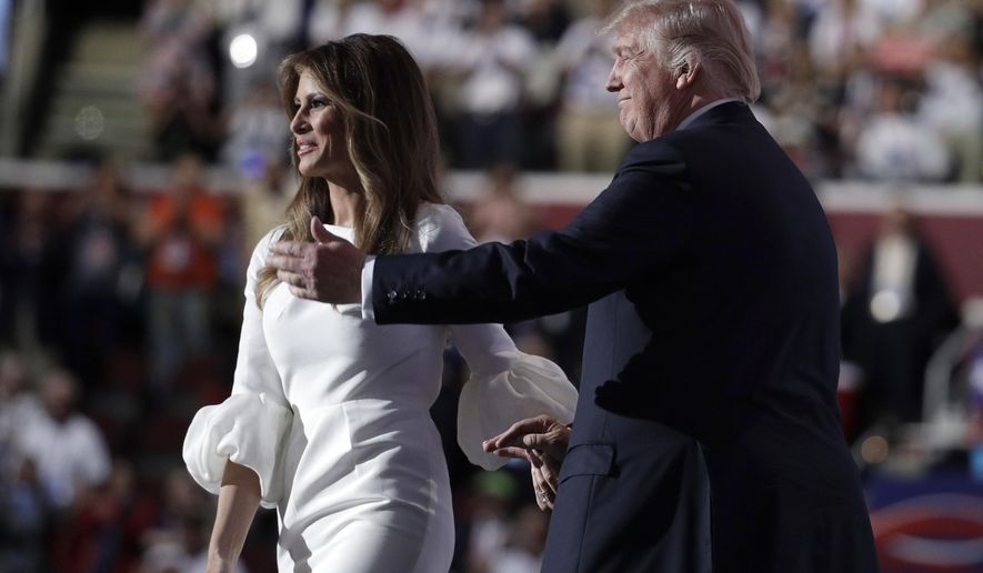 Melania Trump, wife of Republican Presidential Candidate Donald Trump walks to the stage as Donald Trump introduces her during the opening day of the Republican National Convention in Cleveland, Monday, July 18, 2016. (AP Photo/John Locher)
