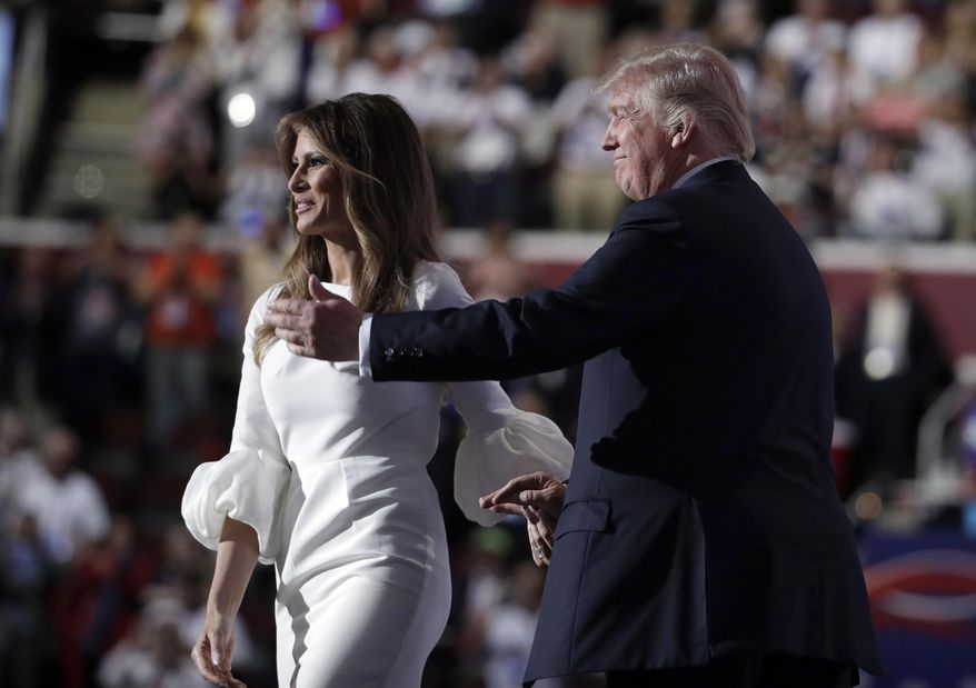 Melania Trump, wife of Republican Presidential Candidate Donald Trump walks to the stage as Donald Trump introduces her during the opening day of the Republican National Convention in Cleveland, Monday, July 18, 2016. (AP Photo/John Locher)