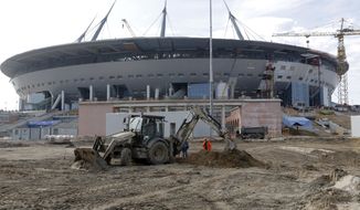 In this Tuesday, April 5, 2016 file photo the stadium which will host some 2018 World Cup matches, under construction in St.Petersburg, Russia. Russian President Vladimir Putin on Monday, July 18, 2016, has ordered officials in St. Petersburg to speed up construction of a trouble-plagued stadium, which is scheduled to host matches during the 2018 World Cup, including a semifinal. (AP Photo/Dmitri Lovetsky, file)