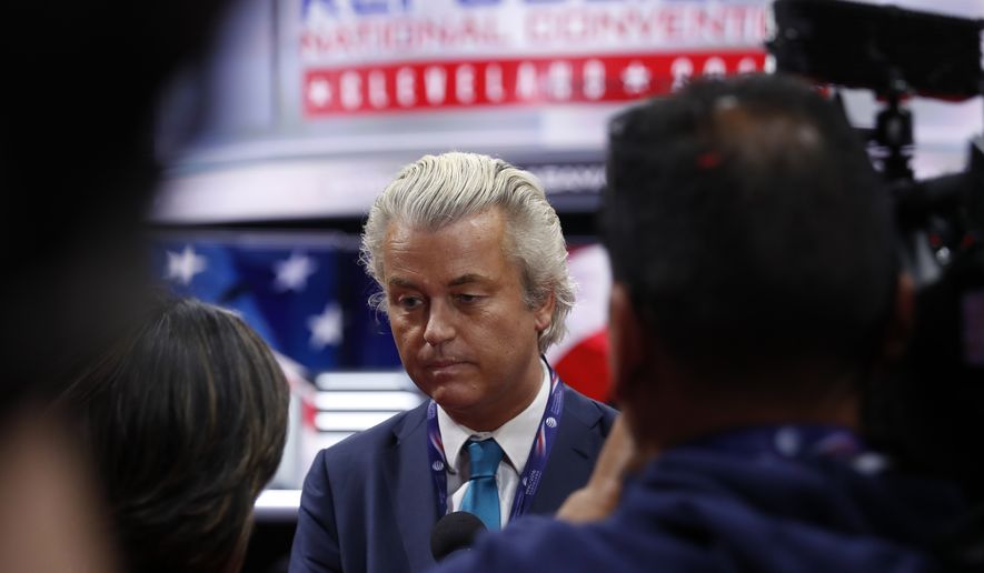 Dutch lawmaker Geert Wilders talks to reporters as he arrives at at Quicken Loans Arena before the start of the second day session of the Republican National Convention in Cleveland, Tuesday, July 19, 2016. (AP Photo/Carolyn Kaster)