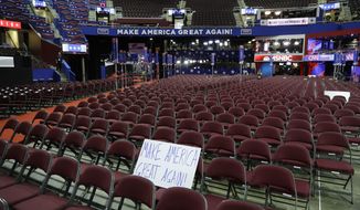 A sign sits on empty chairs before the third day session of the GOP 2016 Convention, Wednesday, July 20, 2016, in Cleveland. (AP Photo/John Locher)