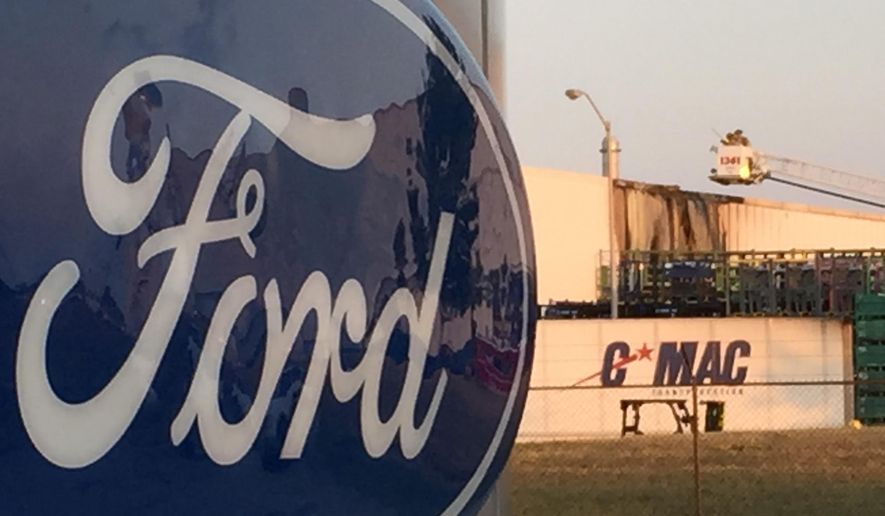 Damage from a fire at Ford’s Flat Rock Assembly can be seen Tuesday July 19, 2016 on a building near the body shop in Flat Rock, Mich. The fire burned part of the Ford Motor Co. plant, prompting an evacuation of part of the facility.No injuries were reported after the Tuesday evening fire at the plant, which makes the Mustang. (Gary Miles/Detroit News via AP) (Gary Miles/The Detroit News via AP)