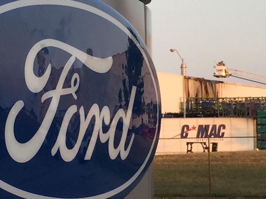 Damage from a fire at Ford’s Flat Rock Assembly can be seen Tuesday July 19, 2016 on a building near the body shop in Flat Rock, Mich. The fire burned part of the Ford Motor Co. plant, prompting an evacuation of part of the facility.No injuries were reported after the Tuesday evening fire at the plant, which makes the Mustang. (Gary Miles/Detroit News via AP) (Gary Miles/The Detroit News via AP)