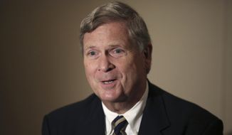 In this Nov. 20, 2015, file photo, then-U.S. Agriculture Secretary Tom Vilsack speaks during an interview with The Associated Press in Tokyo. (AP Photo/Eugene Hoshiko, File)
