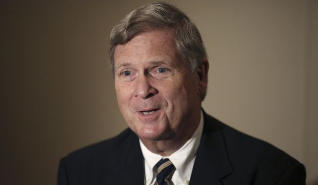 In this Nov. 20, 2015, file photo, then-U.S. Agriculture Secretary Tom Vilsack speaks during an interview with The Associated Press in Tokyo. (AP Photo/Eugene Hoshiko, File)