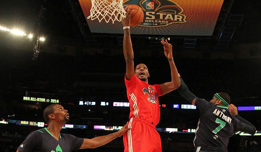 In this Feb. 16, 2014, file photo, West Team&#x27;s Kevin Durant heads to the hoop against Team East&#x27;s Chris Bosh, left, and Carmelo Anthony during the NBA All-Star basketball game in New Orleans. The league took the 2017 game out of Charlotte on Thursday, July 21, 2016, because of its objections to a North Carolina law that limits anti-discrimination protections for lesbian, gay and transgender people. (AP Photo/Bob Donnan, Pool, File)