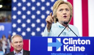 Democratic presidential candidate Hillary Clinton accompanied by Sen. Tim Kaine, D-Va., speaks at a rally at Florida International University Panther Arena in Miami, Saturday, July 23, 2016. Clinton has chosen Kaine to be her running mate. (AP Photo/Andrew Harnik) ** FILE **