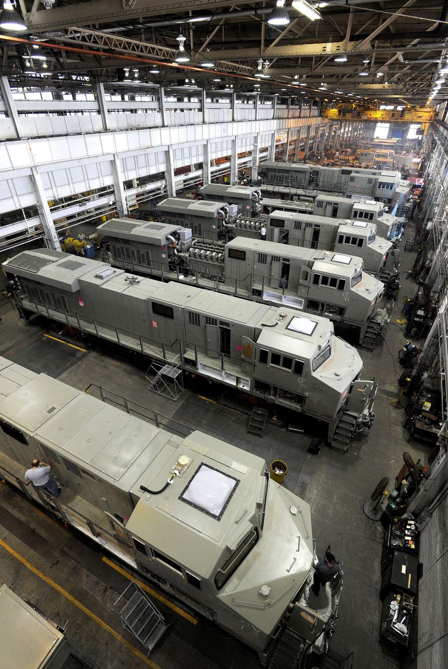 ADVANCE FOR USE SATURDAY, JULY 23 - This July 15, 2016 photo, General Electric Evolution Series locomotives are assembled in Building 10 at GE Transportation in Lawrence Park Township, Erie County, Pa. In the summer of 2016, officials at the plant proposed a redesign of the manufacturing process to make the plant more efficient. (Jack Hanrahan/Erie Times-News via AP)