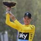 2016 Tour de France winner Chris Froome of Britain celebrates on the podium after the twenty-first and last stage of the Tour de France cycling race in Paris, France, Sunday, July 24, 2016. (AP Photo/Laurent Cipriani)