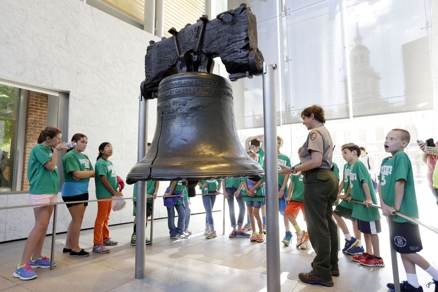 National Park Service guide Terry Papavasilis talks with visitors about the Liberty Bell at Independence National Historical Park in Philadelphia in this Sept. 30, 2013 file photo. The Libertarian and Green Parties both met the August 1 filing deadline to appear on the Nov. 8 presidential ballot in the key swing state of Pennsylvania. (AP Photo/Matt Rourke, File)