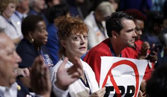 Actress Susan Sarandon holds up a sign during the first day of the Democratic National Convention in Philadelphia , Monday, July 25, 2016. (AP Photo/John Locher)