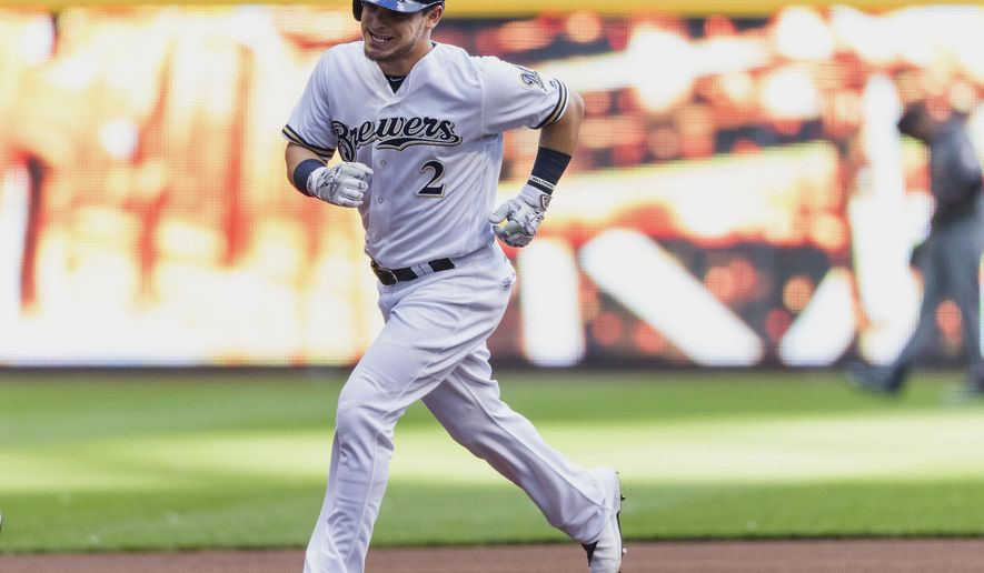Milwaukee Brewers&#x27; Scooter Gennett rounds the bases after hitting a solo home run of of Arizona Diamondbacks&#x27; Braden Shipley batter during the first inning of a baseball game Monday, July 25, 2016, in Milwaukee. (AP Photo/Tom Lynn)