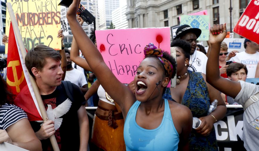 &quot;Hell no, DNC/We won&#39;t vote for Hillary,&quot; demonstrators chanted during a Black Lives Matter protest during the second day of the Democratic National Convention. (Associated Press)