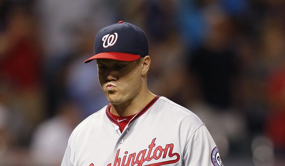 Washington Nationals relief pitcher Jonathan Papelbon walks off after being pulled after loading the bases with Cleveland Indians during the ninth inning of a baseball game Tuesday, July 26, 2016, in Cleveland. The Indians won 7-6. (AP Photo/Ron Schwane)