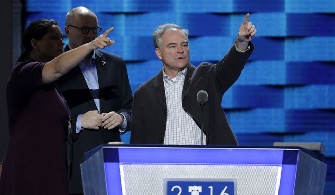 Democratic Vice Presidential candidate, Sen. Tim Kaine, D-Va., looks over the podium as he checks out the stage before the start of the third day session of the Democratic National Convention in Philadelphia, Wednesday, July 27, 2016. (AP Photo/John Locher)