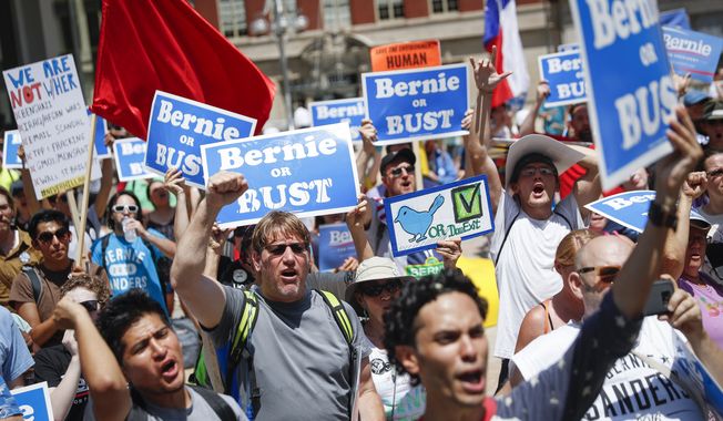Supporters of Sen. Bernie Sanders, I-Vt., yell during a rally near City Hall in Philadelphia, Tuesday, July 26, 2016, during the second day of the Democratic National Convention. (AP Photo/John Minchillo)