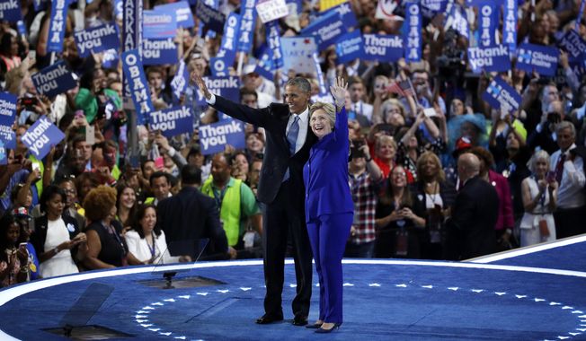 President Obama and Democratic presidential nominee Hillary Clinton wave to the crowd during the third day of the Democratic National Convention on Wednesday in Philadelphia. (Associated Press)