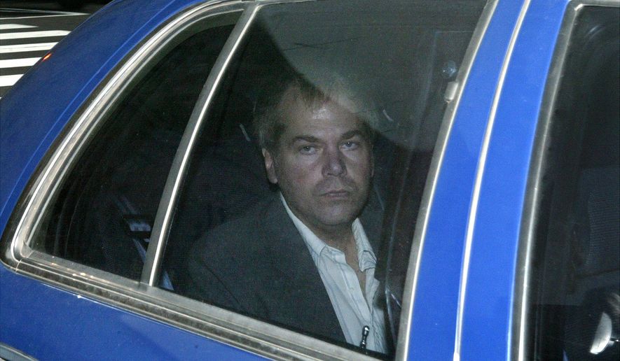 FILE - In this Nov. 18, 2003 file photo, John Hinckley Jr. arrives at U.S. District Court in Washington. A judge says Hinckley, who attempted to assassinate President Ronald Reagan will be allowed to leave a Washington mental hospital and live full-time in Virginia.  (AP Photo/Evan Vucci, File)