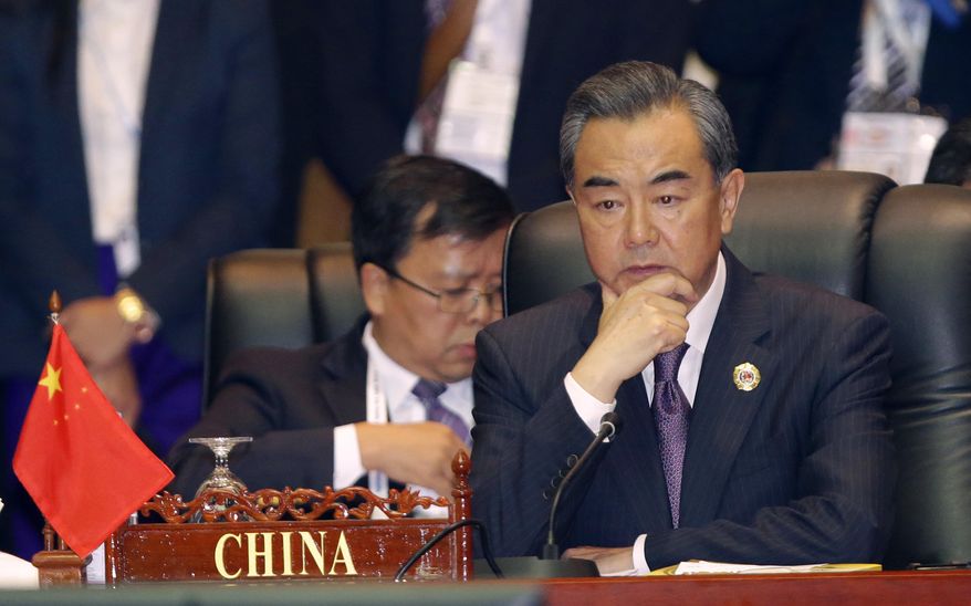 FILE- In this July 26, 2016, file photo, China's Foreign Minister Wang Yi, attends the 23rd ASEAN regional retreat meeting in Vientiane, Laos. Despite the Philippines taking on China in a territorial dispute in the South China Sea and winning big, other Southeast Asian nations with similar disputes who attended this week's meetings are apparently backing down from Beijing. (AP photo/Sakchai Lalit)