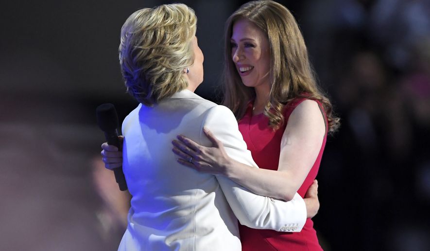 Chelsea Clinton, embraces her mother, Democratic presidential nominee Hillary Clinton, during the final day of the Democratic National Convention on Thursday in Philadelphia. (Associated Press)