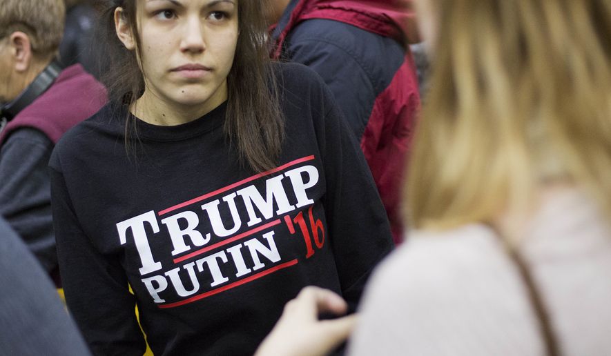 In this Sunday, Feb. 7, 2016, file photo, a woman wears a shirt reading &#39;Trump Putin &#39;16&#39; while waiting for Republican presidential candidate Donald Trump to speak at a campaign event at Plymouth State University in Plymouth, N.H. (AP Photo/David Goldman, File)
