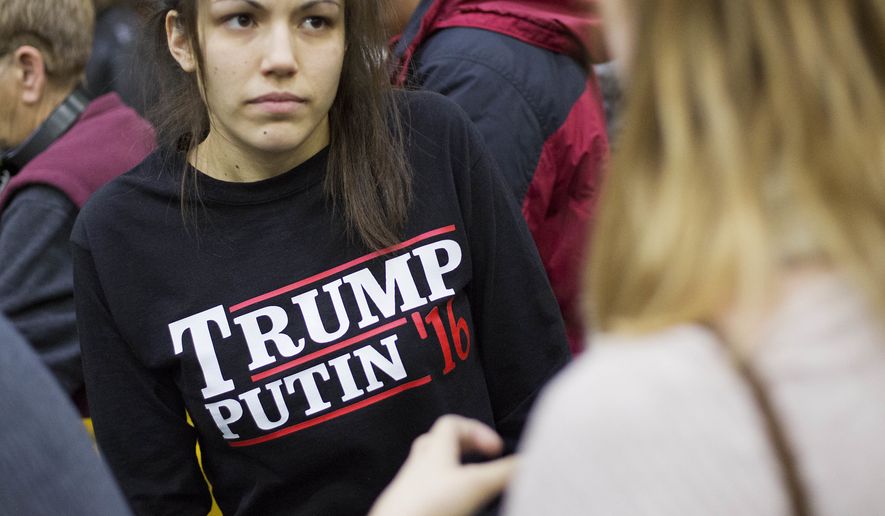 In this Sunday, Feb. 7, 2016, file photo, a woman wears a shirt reading &#x27;Trump Putin &#x27;16&#x27; while waiting for Republican presidential candidate Donald Trump to speak at a campaign event at Plymouth State University in Plymouth, N.H. (AP Photo/David Goldman, File)