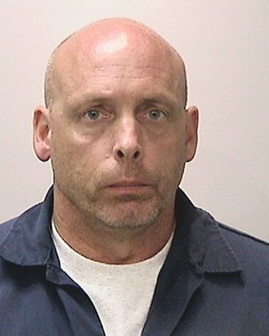 Officer Thomas Abrahamsen, 50, surrendered himself and was booked at San Francisco County Jail on gun charges. (San Francisco Police Department via KGO)