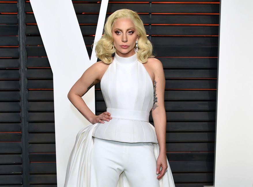 FILE - In this Feb. 28, 2016 file photo, Lady Gaga arrives at the Vanity Fair Oscar Party in Beverly Hills, Calif. One of the country's most impoverished cities will get some time in the Democratic convention spotlight Thursday, July 28, 2016, with some help from Lady Gaga. Thousands of convention delegates have been invited across the Delaware River to Camden for an afternoon concert with the pop star. (Photo by Evan Agostini/Invision/AP, File)