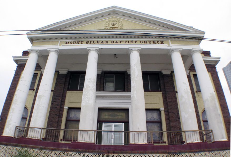 ADVANCE FOR MONDAY AUG. 1 - This Sunday, May 15, 2016 photo shows theMount Gilead Baptist Church in downtown Fort Worth, Texas. Mount Gilead Baptist Church is safe for now. A state district judge recently granted a restraining order that keeps the future of the historic black church, which was offered for sale this spring, in limbo, the latest move in a bitter legal battle that has pitted church members against their pastor and deacons. (Ron T. Ennis/Star-Telegram via AP)