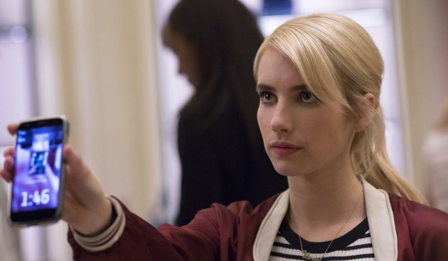 This image released by Lionsgate shows Emma Roberts in a scene from the thriller, "Nerve." Nerve is an app-based game that’s all the rage among the kids. You can choose to be a “player” or a “watcher.” Players are given dares by anonymous masses of watchers with the promise of cash prizes at the end of each dare, which they have to film themselves doing. (Niko Tavernise/Lionsgate via AP)
