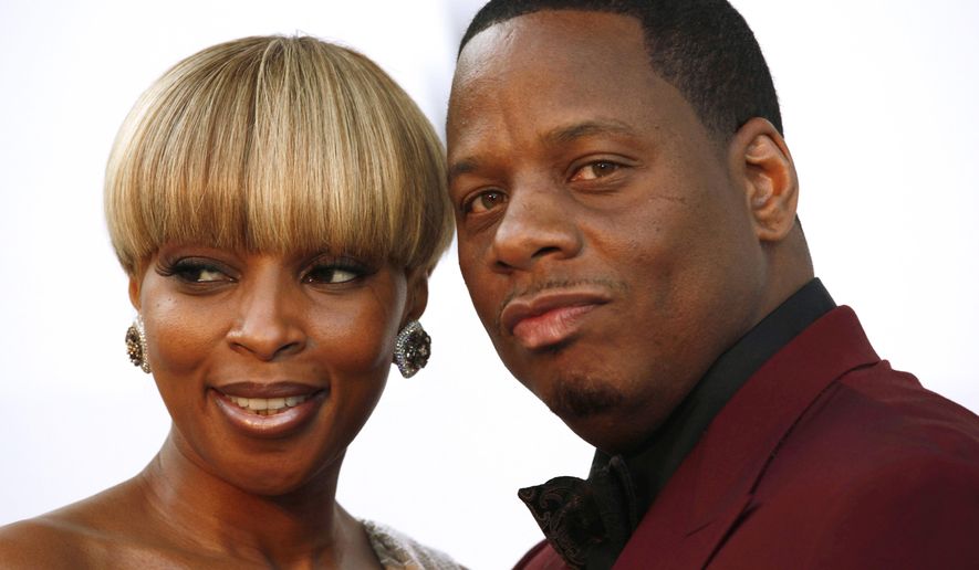 FILE - In this May 20, 2010 file photo, singer Mary J. Blige and her husband, Martin Kendu Isaacs, arrive for the amfAR Cinema Against AIDS benefit during the 63rd Cannes international film festival, in Cap d'Antibes, southern France. Blige is ending her marriage to her husband-manager after nearly 13 years. Court records show the singer filed for divorce from Isaacs on Tuesday, July 26, 2016, is Los Angeles, citing irreconcilable differences. (AP Photo/Matt Sayles, File)