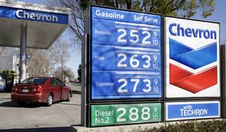 In this Monday, Feb. 8, 2016, file photo, gas prices are displayed at a Chevron gas station in Sacramento, Calif. Chevron reports financial results Friday, July 29, 2016. (AP Photo/Rich Pedroncelli, File)
