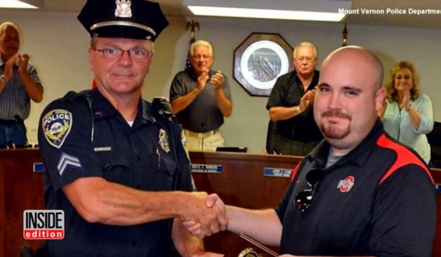 Ohio concealed carrier Dylan DeBoard was presented an award this week for saving Mount Vernon Police Cpl. Michael Wheeler, who was being attacked by a suspect. (Mount Vernon Police Department via Inside Edition)