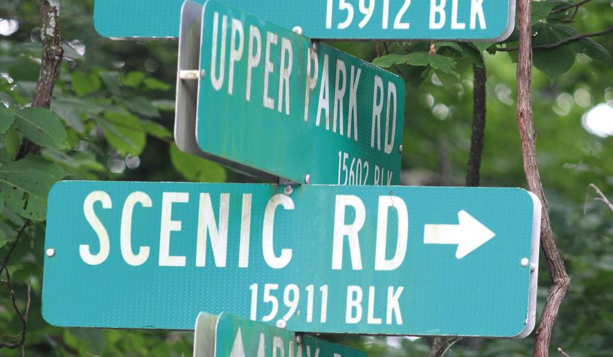 ADVANCE FOR USE SUNDAY, JULY 31, 2016 AND THEREAFTER - In this May, 2016 photo, a sign for Army Road is one of the few remaining clues to the existence of a former Nike missile base located in the middle of Pere Marquette State Park near Grafton, Ill. Fences and one or two remaining buildings are all that is left of the Nike missile facility. The base was one of more than 260 Nike missile facilities protecting the country from Russian bombers from the 1950s through the mid-1970s. (Scott Cousins/The Telegraph via AP)