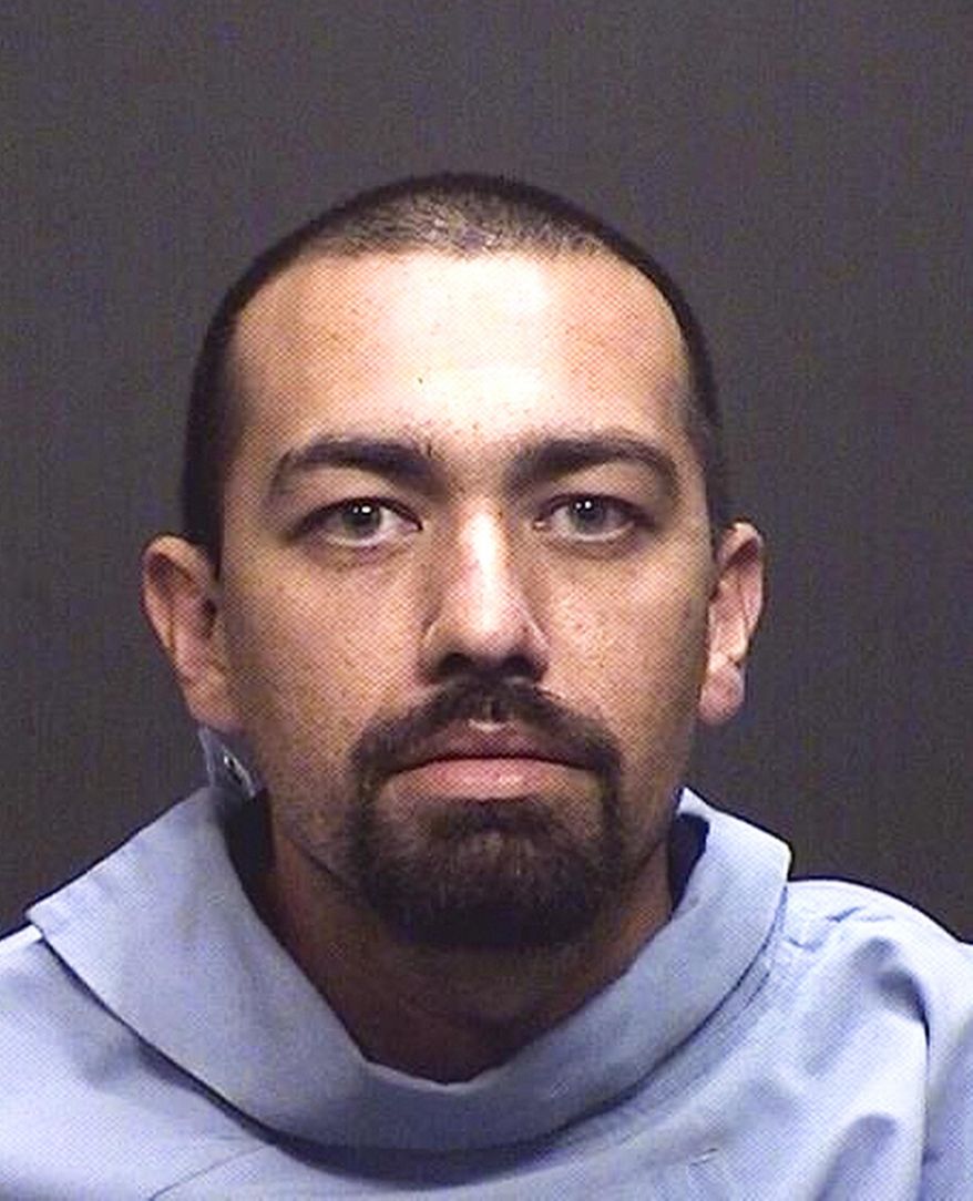 This undated booking photo provided by the Tucson Police Department shows Jesus Isaac Rael. Rael, a bank robbery suspect who was fatally shot by police after leading officers on a chase, stealing a police car, carjacking a citizen's vehicle and shooting at officers during two separate confrontations. Police say the series of events Thursday afternoon began in southwest Tucson when Marana police tried to stop the suspect wanted in a Wednesday bank robbery.(Tucson Police Department via AP)