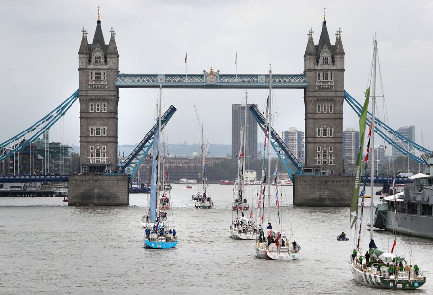 London&#x27;s Tower Bridge opens its gates to welcome home the 12-strong fleet of the biennial Clipper Round the World yacht race, Saturday, July 30, 2016. Late on Friday night the fleet crossed the official race finish line in Southend, after a 30-hour tightly-fought battle across 198 nautical miles of the North Sea. (Steve Parsons/PA via AP)