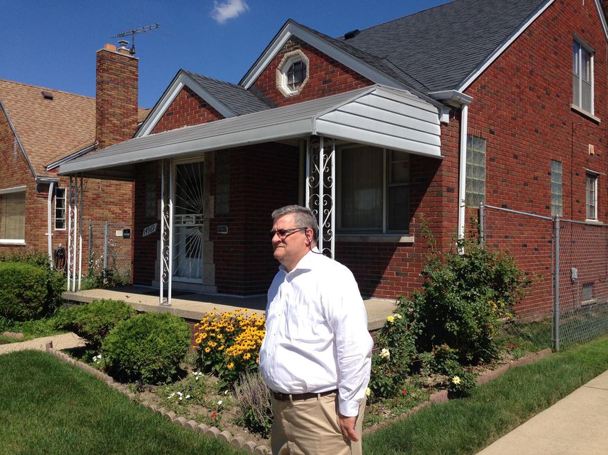 ADVANCE FOR USE SUNDAY AND THERE AFTER - In this July 26, 2016, photo, Ron Stefanski poses for a photo as he revisits his grandmother&#39;s former east side home in Detroit, about 25 years after she was brutally beaten and slain there by a 14-year-old dropout. Stefanski markets the Detroit Collective Impact-Pathway to Education &amp;amp; Work. The program is a way for teens and adults to earn career credentials and accredited diplomas and takes a year to 18 months to complete. Stefanski says he wanted nothing more to do with Detroit after Vicki Stefanski was killed in 1991, but now is eager to help in the city&#39;s turnaround. (AP Photo/Corey R. Williams)