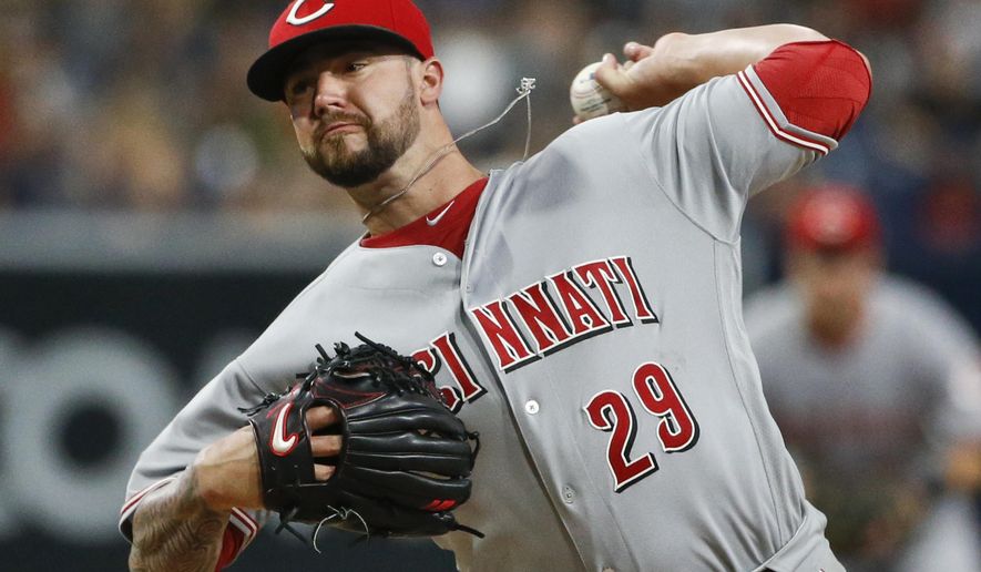 Cincinnati Reds starting pitcher Brandon Finnegan works against the San Diego Padres during the first inning of a baseball game Friday, July 29, 2016, in San Diego. (AP Photo/Lenny Ignelzi)